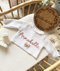 Cream frilly cardigan - name and bow design