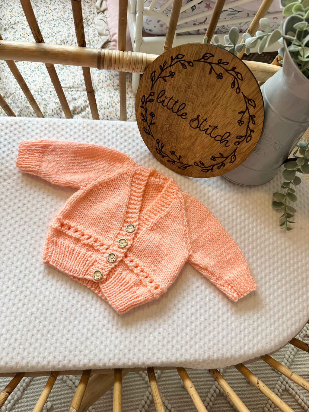 Orange newborn handknitted cardigan