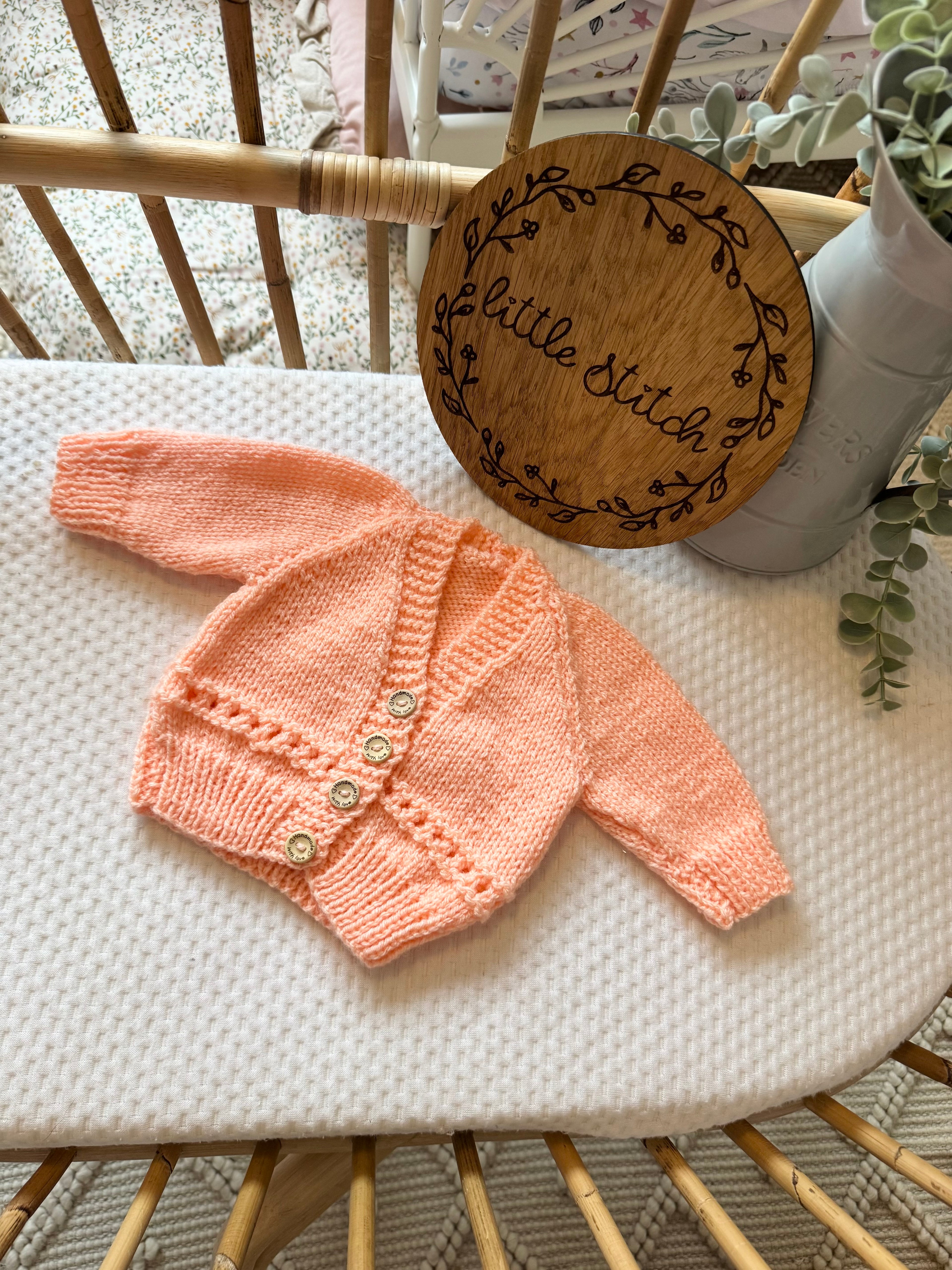Orange newborn handknitted cardigan
