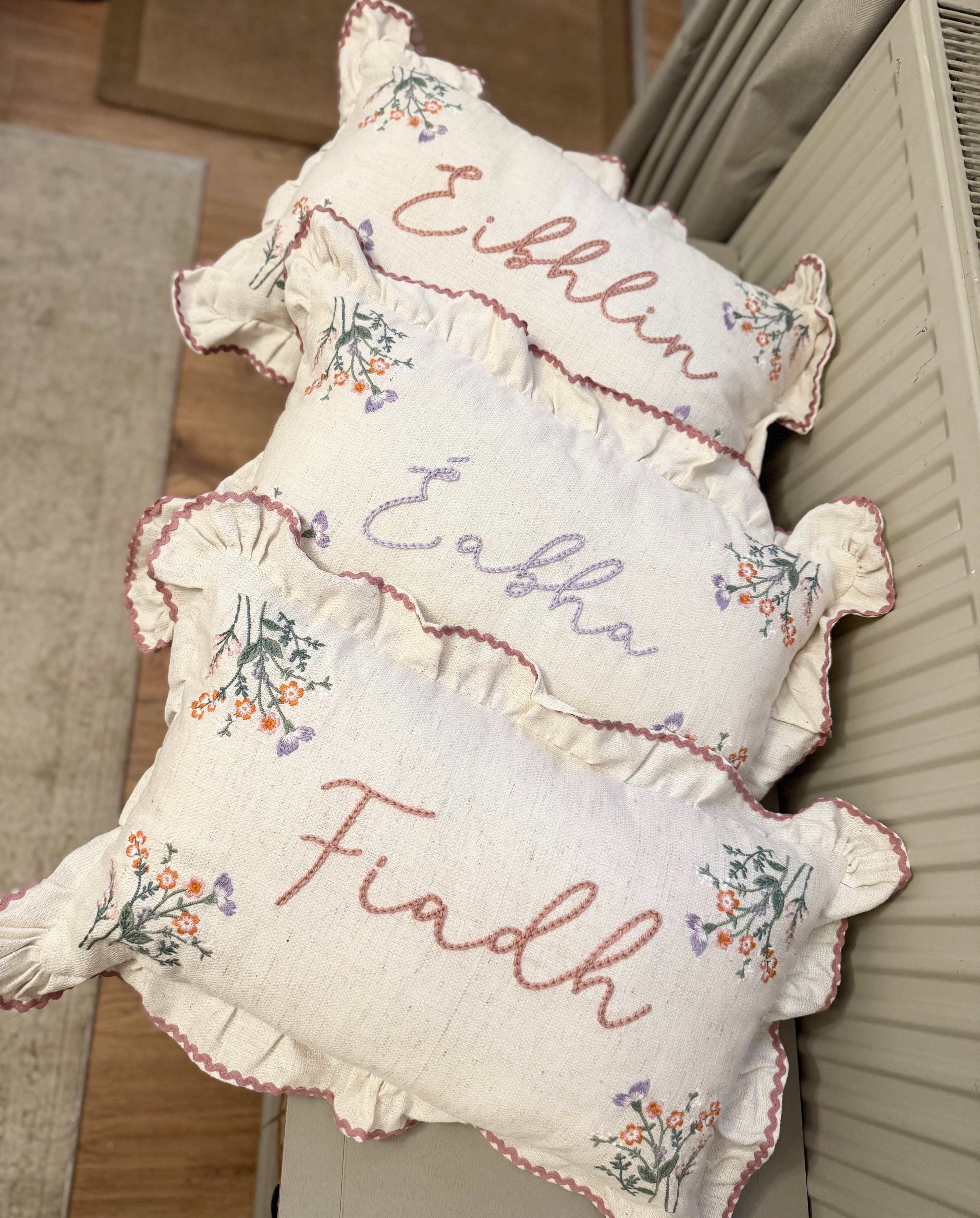Hand embroidered floral cushion