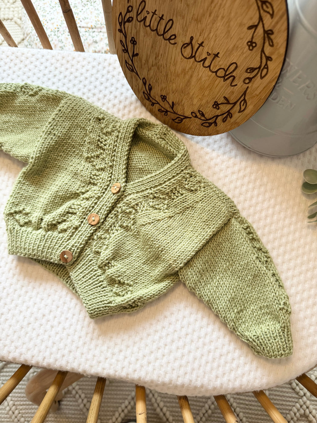 Green newborn handknitted cardigan
