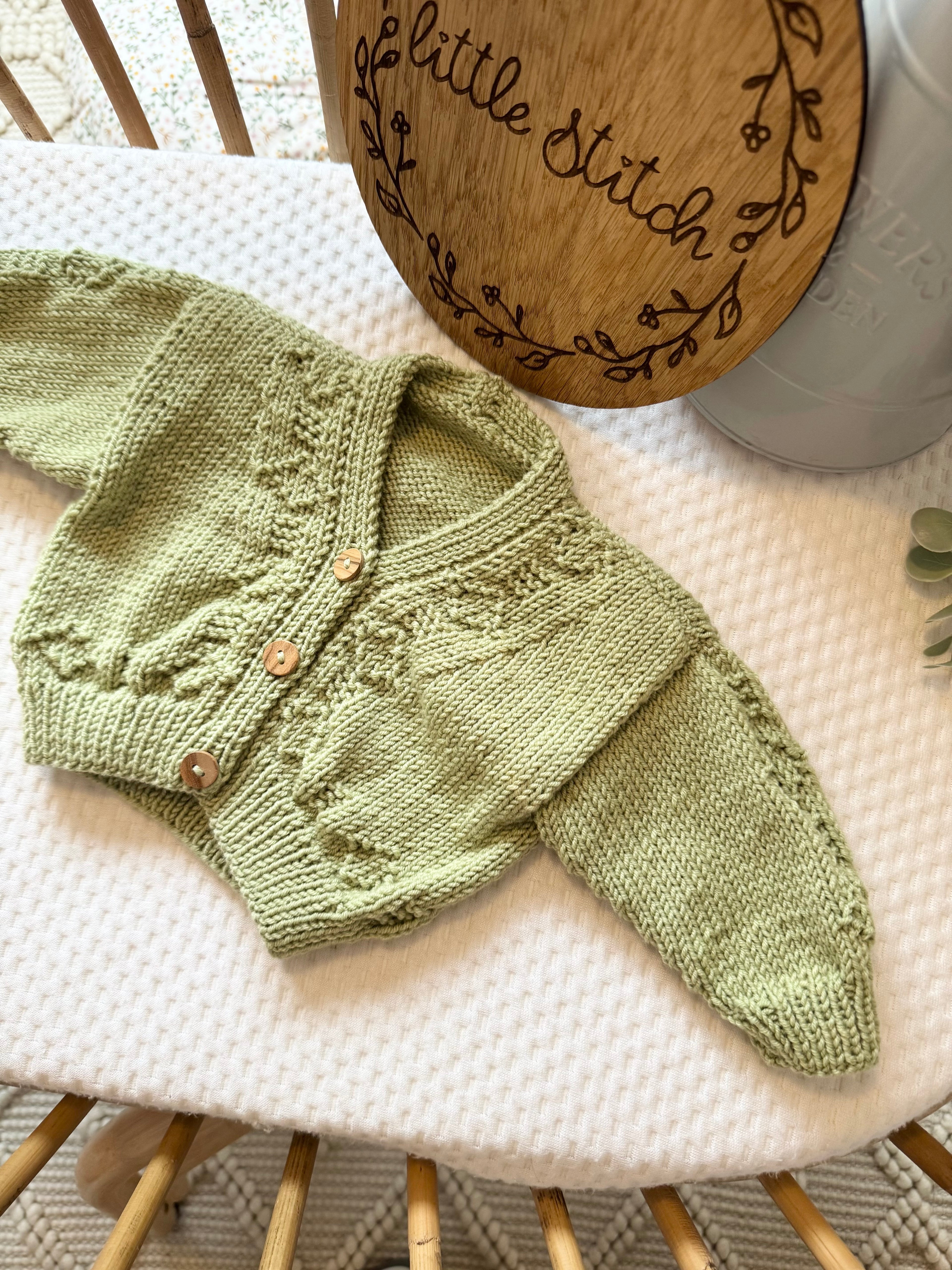 Green newborn handknitted cardigan