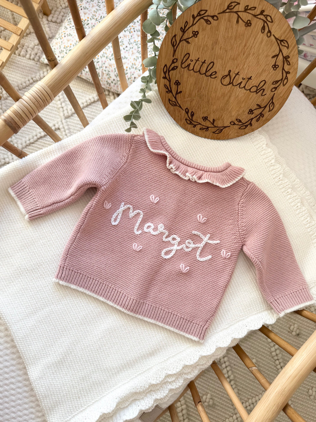 Pink frilly cardigan - (add to notes the name & hearts or roses around the name)