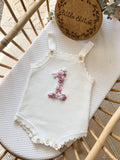 Floral ‘1’ romper 12-18m