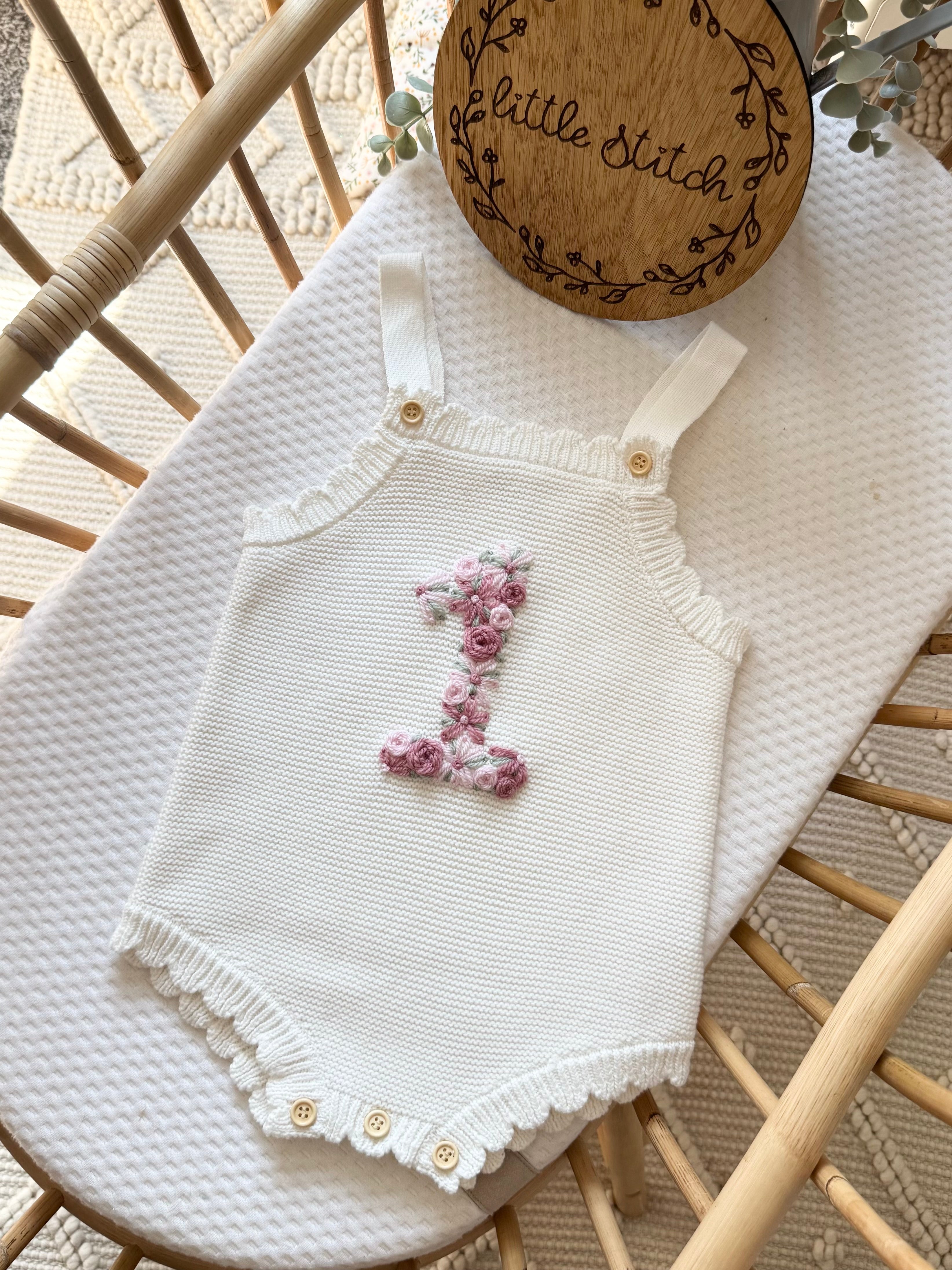 Floral ‘1’ romper 12-18m