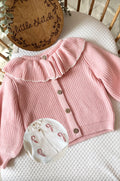 Pink frilly cardigan - candy cane design and 1 name on the back