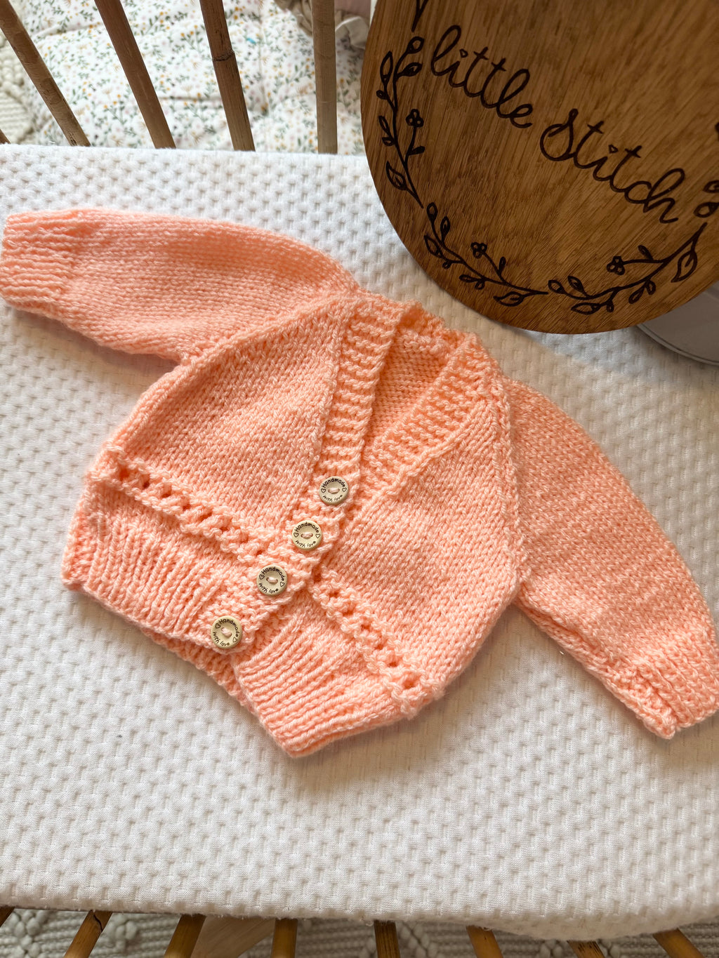 Orange newborn handknitted cardigan