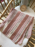 Hand crotched blanket - mix of pinks and cream